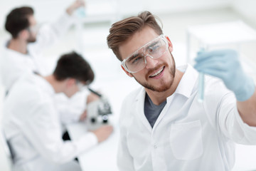 Wall Mural - closeup. scientist with beaker