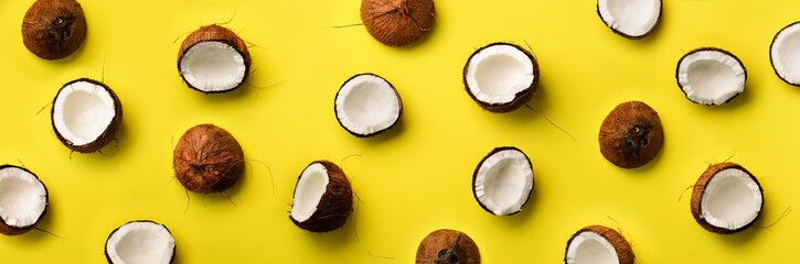 pattern with ripe coconuts on yellow background. top view. copy space. pop art design, creative summ