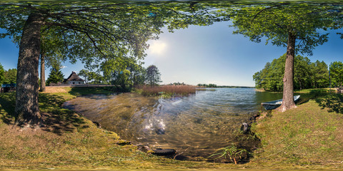 Wall Mural - full seamless panorama 360 by 180 angle view on the shore of huge forest lake with a boat in sunny summer day in equirectangular projection, skybox VR virtual reality content