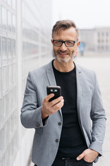 Wall Mural - Businessman holding a mobile phone