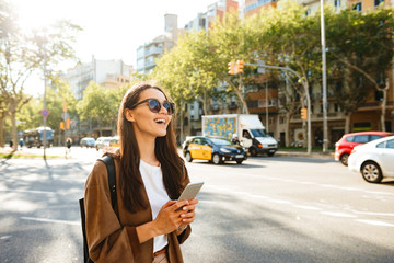 Canvas Print - Amazing happy beautiful woman using mobile phone.