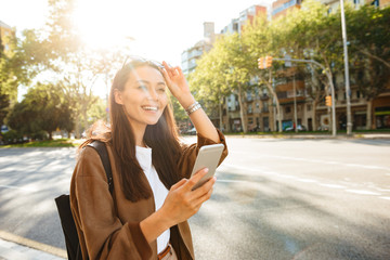 Canvas Print - Amazing happy beautiful woman using mobile phone.