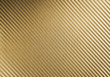 Metallic shiny texture of gold carbon fiber self-adhesive paper. Material for racing car modification. Material design for background, wallpaper, graphic design