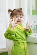 © Oksana Kuzmina - child in bathrobe washing hands in bathroom and showing soapy palms