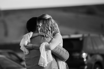 Black and white photo, the reaction of the man and the woman after she said yes. Marriage proposal, couple in love