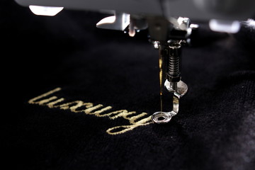 embroidery of gold lettering 