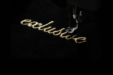 Wall Mural - embroidery of gold lettering 