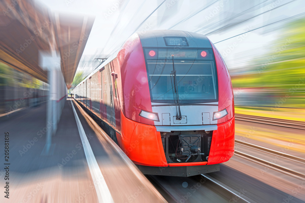 High-speed electric train with motion blur. Train at the railway station. - obrazy, fototapety, plakaty 