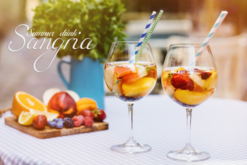 Wall Mural - Top view of summer dinks, fruit cocktails on white wood table with berries, mint leaves