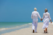 © Darren Baker - Happy Senior Couple Walking Holding Hands Tropical Beach