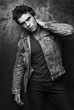 © Bakulov - Fashion portrait of beautiful men. Stylish denim jacket, trendy hairstyle