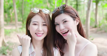 Poster - two beauty women smile happily