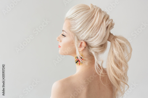 Beautiful young woman with a trendy blonde hairstyle, head and shoulders portrai Poster Mural XXL