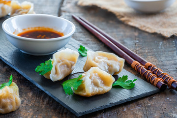 Chinese pork dumplings - dim sum - with sweet chili dipping sauce