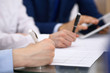 © rogerphoto - Bookkeepers team or financial inspectors  making report, calculating and checking balance. Tax service financial document. Audit or meeting concept