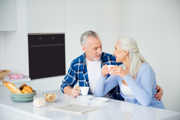 Sticker - Portrait of lovely sweet stylish attractive couple sitting at table with cups of coffee bakery, embracing looking at each other, having conversation, communication