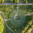 Aerial view a natural labyrinth in the garden. Photo from the drone