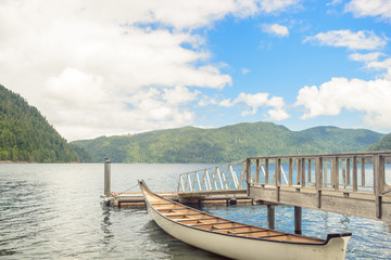 Wall Mural - Wooden boat pier on mountain lake