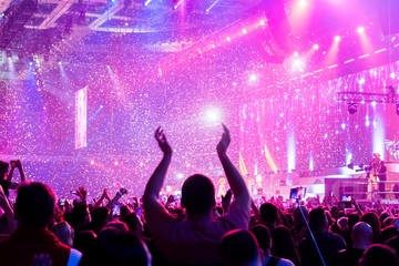 Crowd at a concert with hands up