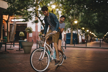 Young couple on bike ride in the city