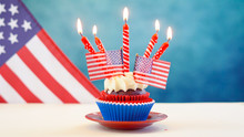Red White And Blue Theme Cupcakes With USA Flags For Independance Day Or USA Theme Party Food.