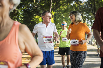 Canvas Print - Senior athletes running at the park