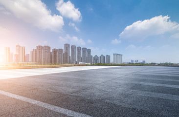 Wall Mural - Panoramic skyline and modern business office buildings with empty road,empty concrete square floor