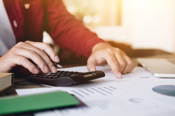 Close up view of bookkeeper or financial inspector hands making report, calculating or checking balance. Home finances, investment, economy, saving money or insurance concept