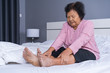 © geargodz - senior woman with leg pain in bed