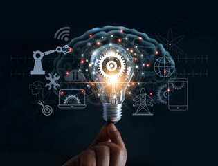 hand holding light bulb and cog inside and innovation icon network connection on brain background, i