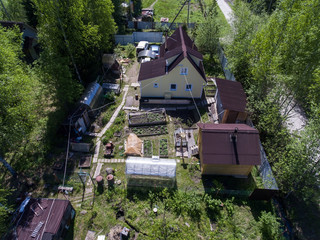 Wall Mural - Summer house, barns, sauna, greenhouses in garden on small land of country, Russia