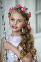 little girl with flowers in her hair portrait