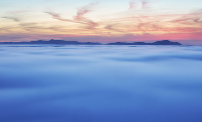 Wall Mural - Dramatic clouds with mountain silhouette in dawn, Slovakia.