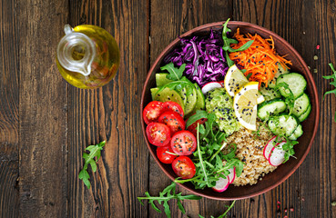 Wall Mural - Vegetarian Buddha bowl with quinoa and fresh vegetables. Healthy food concept. Vegan salad. Top view. Flat lay