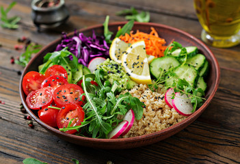 Wall Mural - Vegetarian Buddha bowl with quinoa and fresh vegetables. Healthy food concept. Vegan salad.