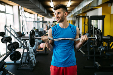 Determined male exercising in gym