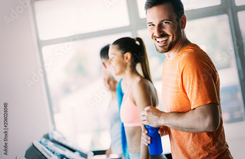 Fotografie, Obraz Picture of people running on treadmill in gym