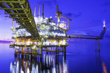 Oil and gas offshore platform on night time.