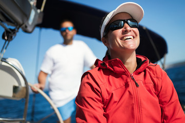 Canvas Print - Attractive strong woman sailing with her boat