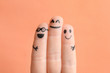 © New Africa - Fingers with drawings of happy faces against color background. Unity concept