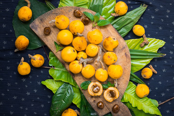 Fresh ripe mushmula or loquat fruit. Good for breakfast and desserts. Evergreen subtropical tree orange sweet and juicy fruit widely spread in Georgia, Japan, Korea, Spain and other asian countries.