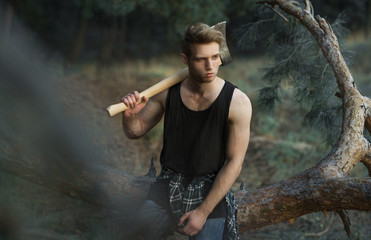 Poster - a man with an ax in the woods