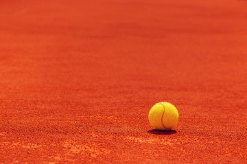 Wall Mural - Tennis ball on clay court