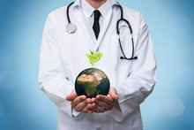 Doctor Holding A Planet Earth Globe In His Hands. Environment And Healthy Concept For Global Ecology