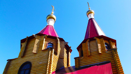 Beautiful domes of the temple against the blue sky.