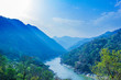 morning top view of Holy Ganges river that flows through Rishikesh passage of mountains looks divine 