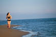 © blicsejo - Healthy young fitness woman runner running on sunrise seaside trail