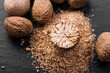 aromatic nutmeg on a dark stone background