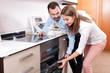 © JackF - Spouses shopping for kitchen appliances