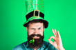 © Svitlana - St Patrick's Day. Bearded man in green men hats celebrate Patricks Day. St Patrick's Day Party. Green men hat or top hats. Green hat with clover. Saint Patrick having fun. Ireland traditional.